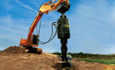 Excavator drilling with a large Digga auger drive