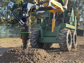 Mini loader drilling with a Digga auger drive