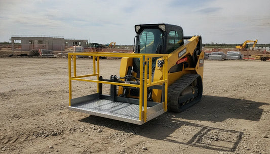 Skid steer fitted with a steel work platform attachment