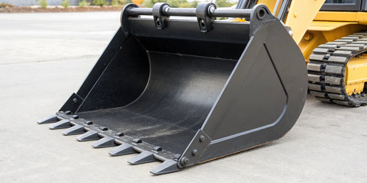 A heavy-duty tilt grading bucket for a mini excavator with a reinforced cutting edge.