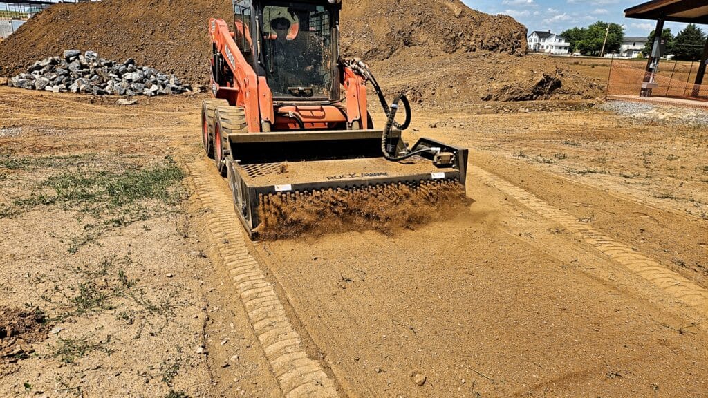 Mini Skid Steer Power Rake Attachment by Rockaway